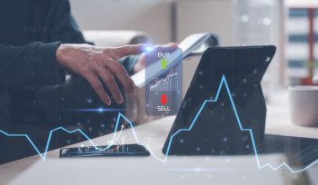 Investment stock market trading concept, businessman analyzing trading chart, buy and sell prices, investment financial plan and strategy